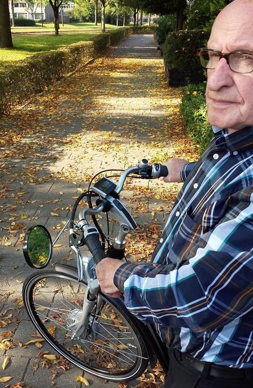 Hurkmans en zijn elektrische fiets. Foto: K. van den Hout