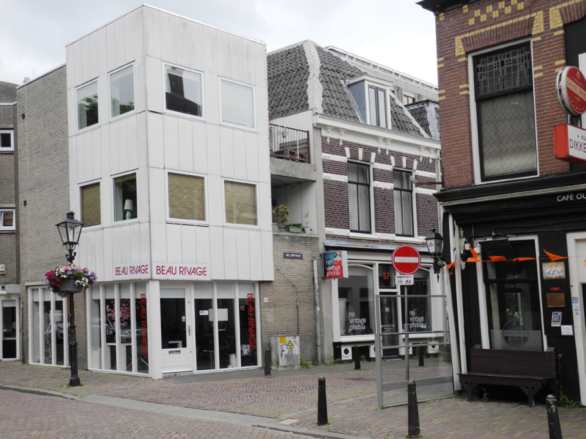 De muurschildering op de Willemstraat is verdwenen achter de nieuwbouw van Beau Rivage.